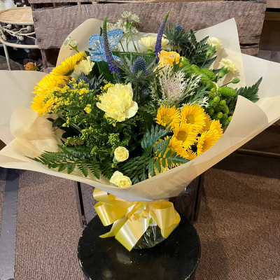 Sunrise - Energise their day with a stunning surprise. A warm collection of seasonal flowers artistically arranged by an artistic florist. Available for same day delivery when ordered before 2pm.