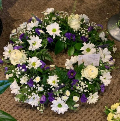 Funeral Wreath - Wreath in purples, whites and creams with beautiful green foliage